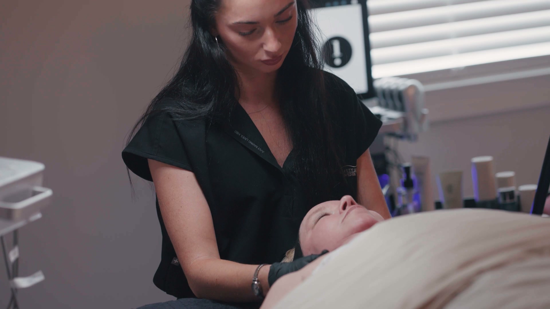 Glow provider supporting a skincare routine in the treatment room